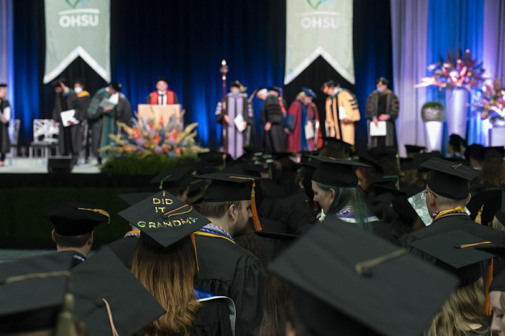 Oregon Health & Science University held its first in-person convocation in two years on Sunday, June 5, 2022. After the COVID-19 pandemic forced the annual tradition to go virtual, the university offered both an in-person and a remote participation option in 2022. Shown here are graduates celebrating during the 2022 convocation ceremony. (OHSU/EdComm)