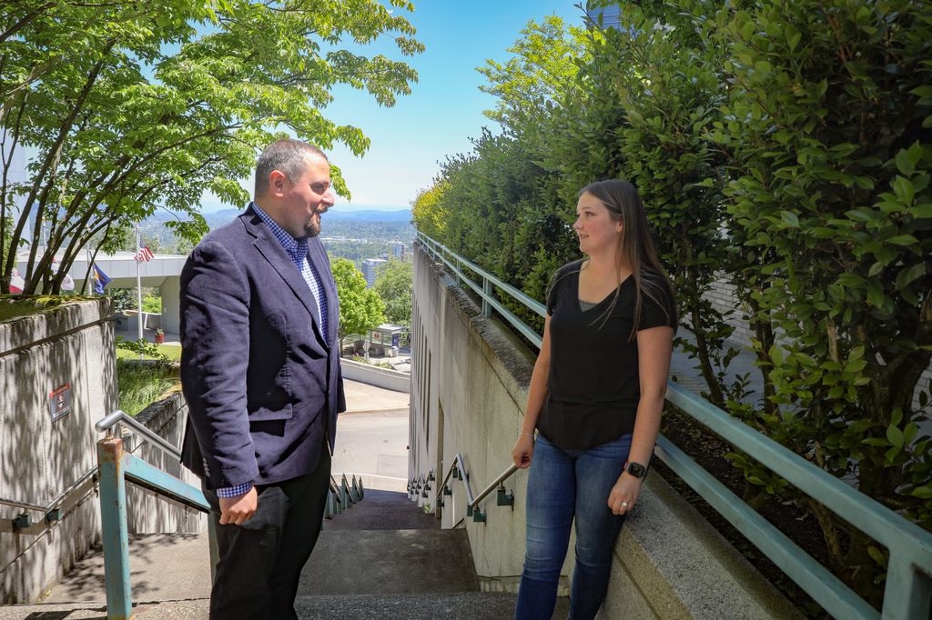 OHSU cardiologist and the Knight Cardiovascular Institute Hypertrophic Cardiomyopathy Center Director Ahmad Masri, M.D., M.S., talks with patient Megan Link, 25, of Sandy, right, who was born with the heart&nbsp;condition known as hypertrophic cardiomyopathy. She was a presenter at the 2023 World&nbsp;Heart Summit in May 2023. (OHSU/Christine Torres Hicks)