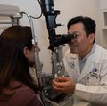 David Huang, M.D., Ph.D., provides an eye exam