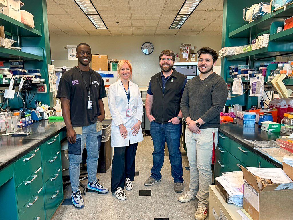 A team of researchers at OHSU has developed a framework to better evaluate the different types of UBA5 mutations, which cause a rare, deadly neurodegenerative disease in children. From left: Kofi Asare-Konadu, research assistant; Ruth Napier, Ph.D., assistant professor of molecular microbiology and immunology at OHSU School of Medicine; Jonathan Pruneda, Ph.D., assistant professor of molecular microbiology and immunology at OHSU School of Medicine; and Nick Alvarez, research assistant. (OHSU)