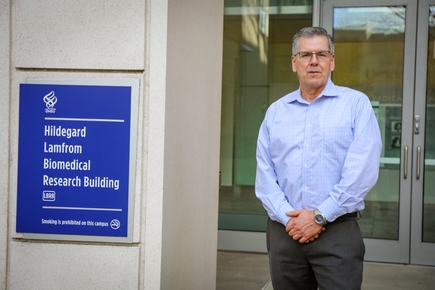 William Rooney, Ph.D., has short gray hair and a light dress shirt and eye glasses, is the director of the Advanced Imaging Research Center, AIRC, at OHSU. (OHSU/Christine Torres Hicks)