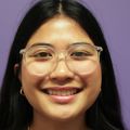 Arianna Kapileo has long straight black hair, eye glasses, and smiling in an OHSU NICU nutrition room.