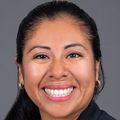 Cirila Estela Vasquez Guzman, Ph.D., has long black hair pulled back into a ponytail and a suit jacket with shirt, smiling.