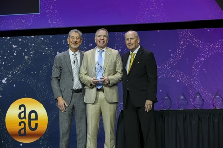 Kenneth Wiltbank on stage, receiving award