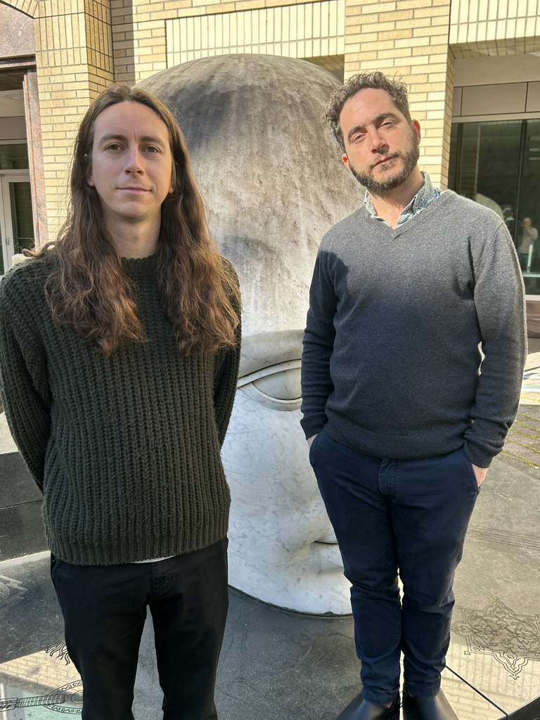 Austin Schubert with Arpiar Saunders, Ph.D. (Courtesy)