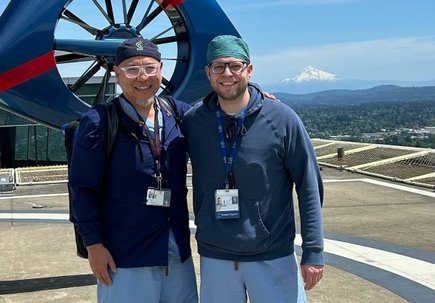 Albert Chi, M.D., and Jesse Allen, M.D., on the helipad at OHSU Hospital