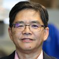 Hui Wu, Ph.D. (OHSU) Wu has short black hair, eye glasses, and a black suit jacket over a red/white dress shirt.