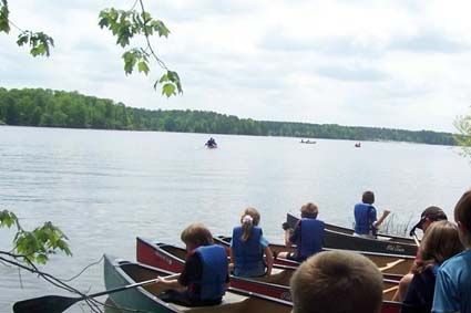 Group canoeing on Harris Lake