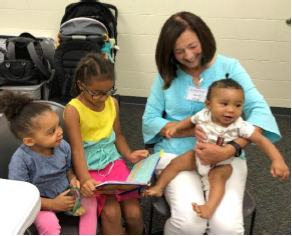 BabyRead volunteer, Martha Clardy, and her "clients"