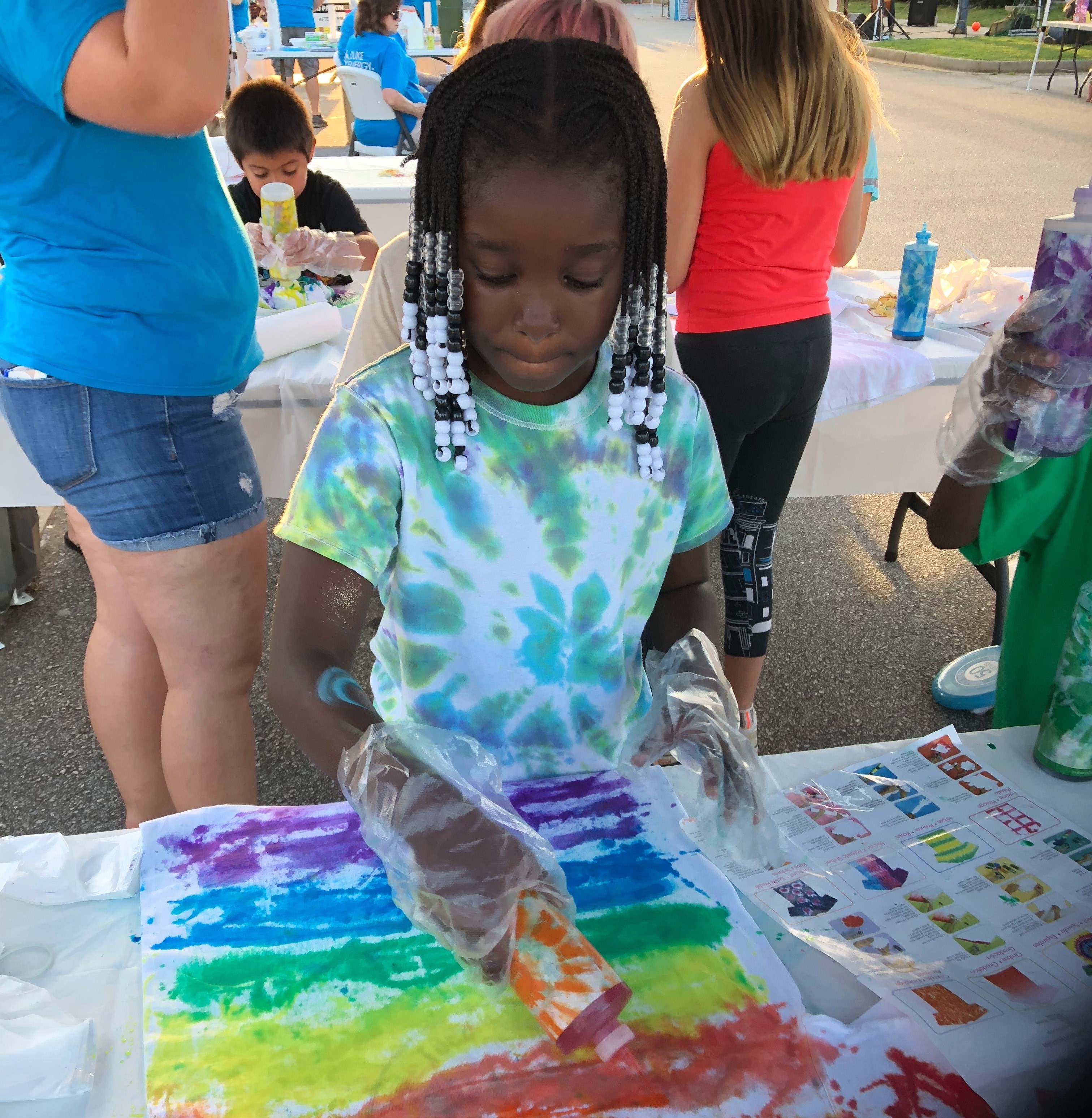 Tie-dying shirts at Duke Energy Night in Walhalla, S.C.
