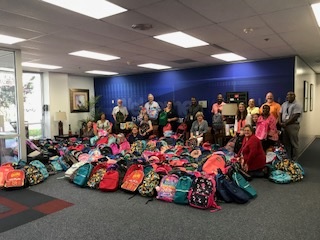 Robinson employees donating more than 760 backpacks to over 20 local schools 