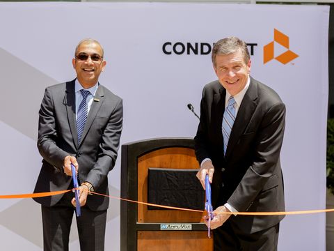 Conduent Incorporated’s CEO Ashok Vemuri and North Carolina Governor Roy Cooper celebrate the opening of Conduent’s technology and innovation hub in Morrisville, N.C.