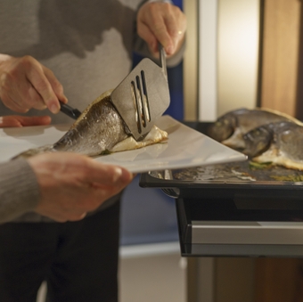 Preparing gilthead seabream, from the oven