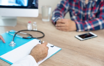 Cropped Image Of Doctor With Patient In Hospital