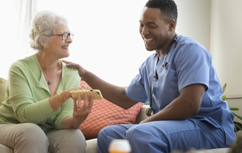 Nurse and patient using cell phone