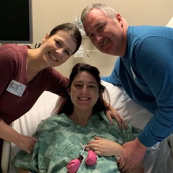 Taylor with her parents Tracie and Randy Bullins