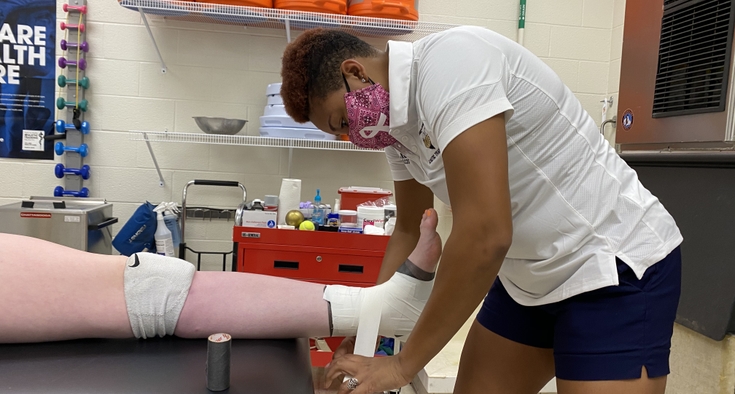 How high school athletic trainers stand guard on COVID