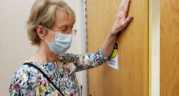 Sheree Jones prays outside the COVID-19 unit