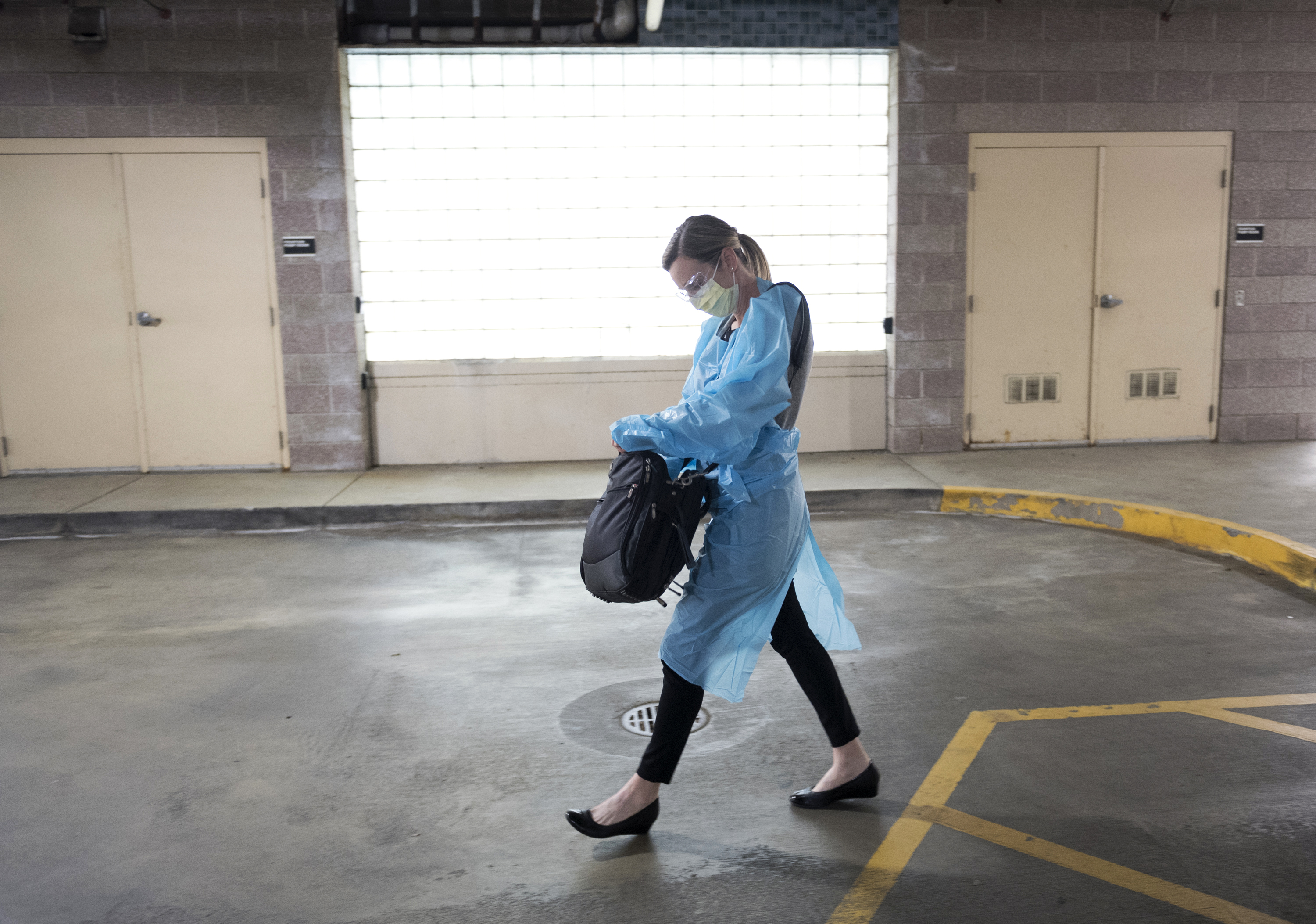 A Novant Health provider walks out to the parking lot for a sick visit.