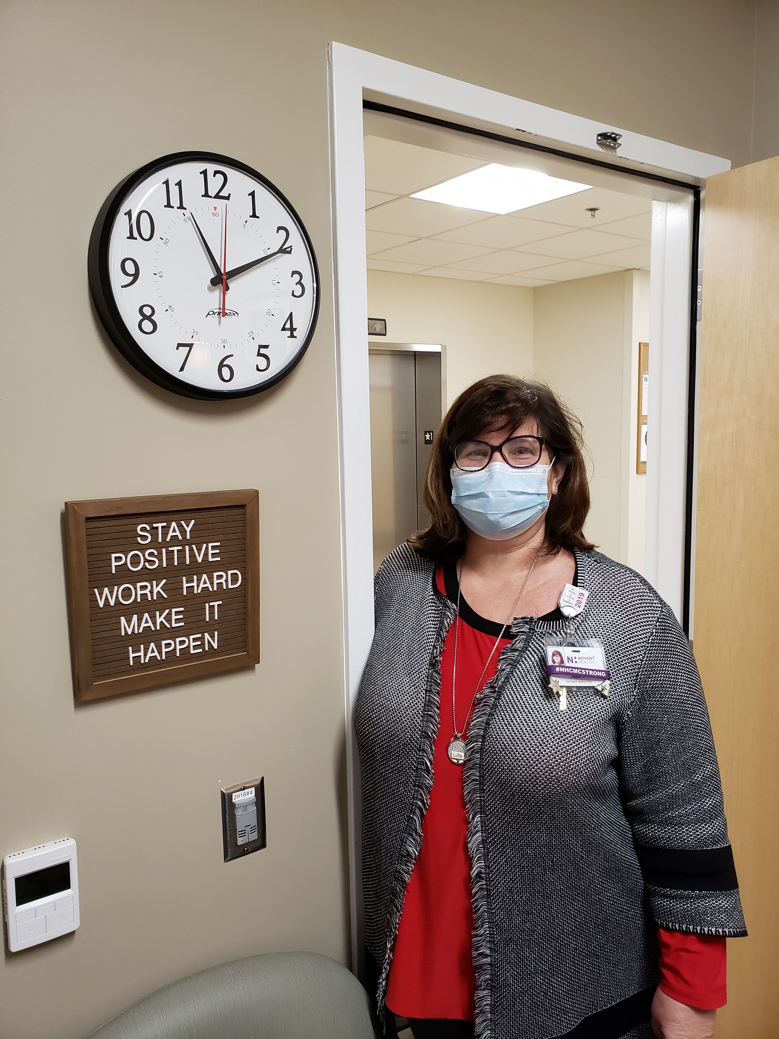 Jamie Vogler with her office sign