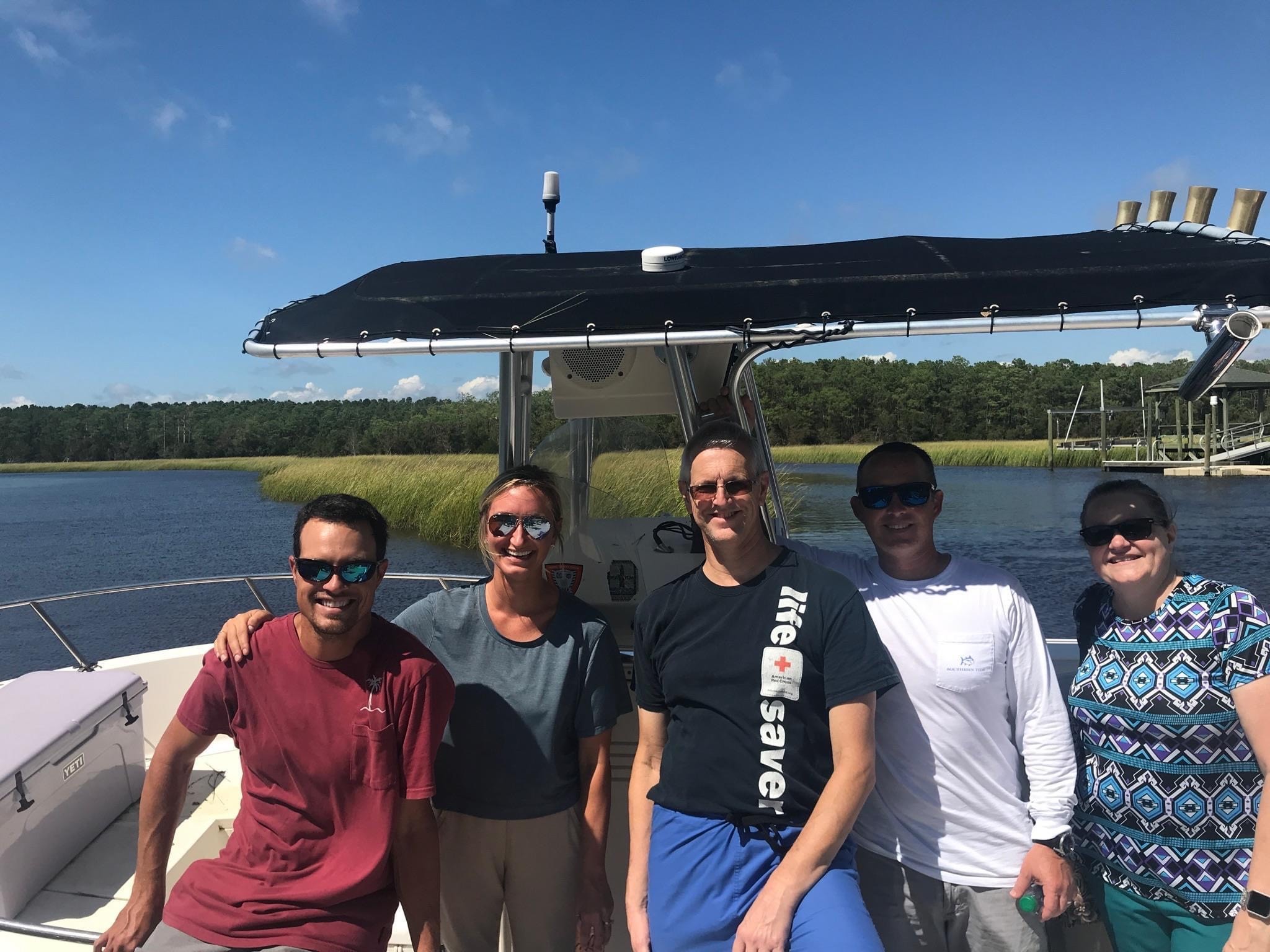 Dr. Mason and fellow team members take boat to work due to hurricane flooding. 