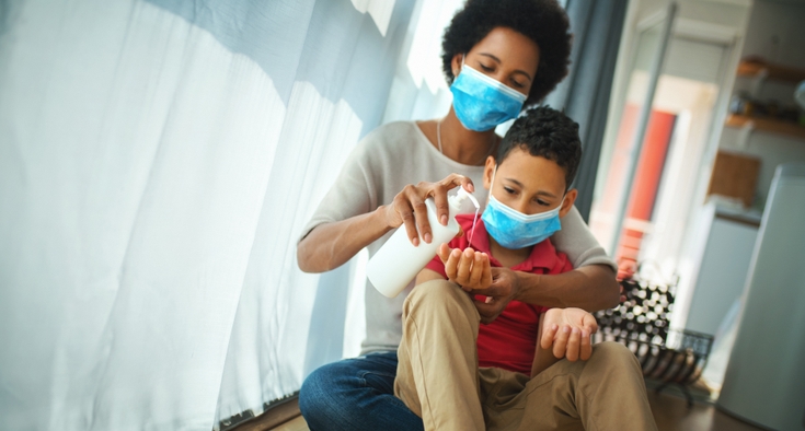 Mother and son wear masks to stay safe