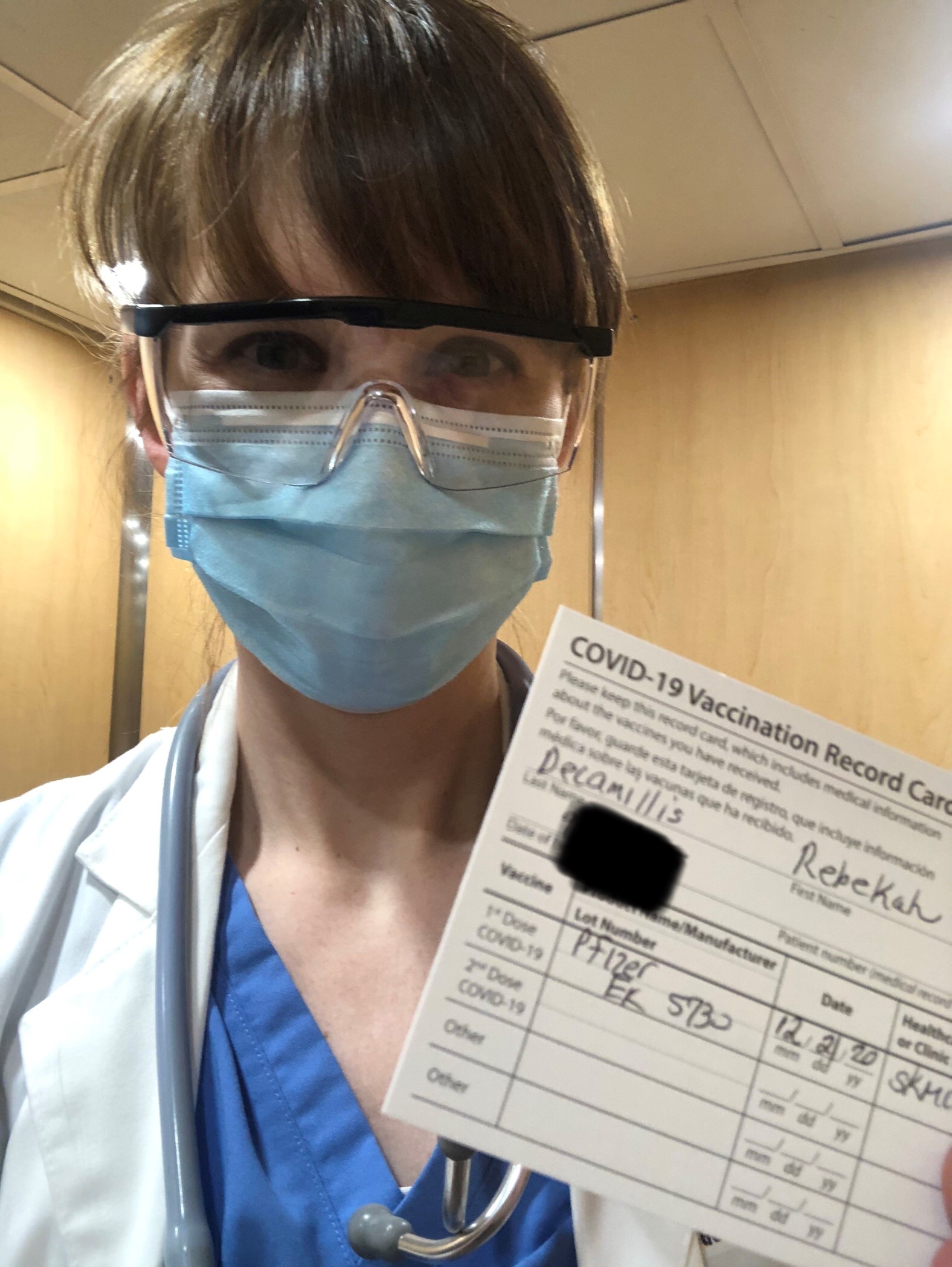 Becky DeCamillis smiles after receiving her COVID-19 vaccine.