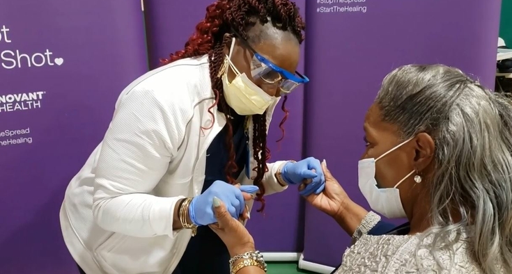 Singing LPN Mel McMillan soothes nervous Vergie Hart vaccine recipient