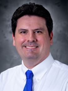 Dr. Christopher Pizzola smiles