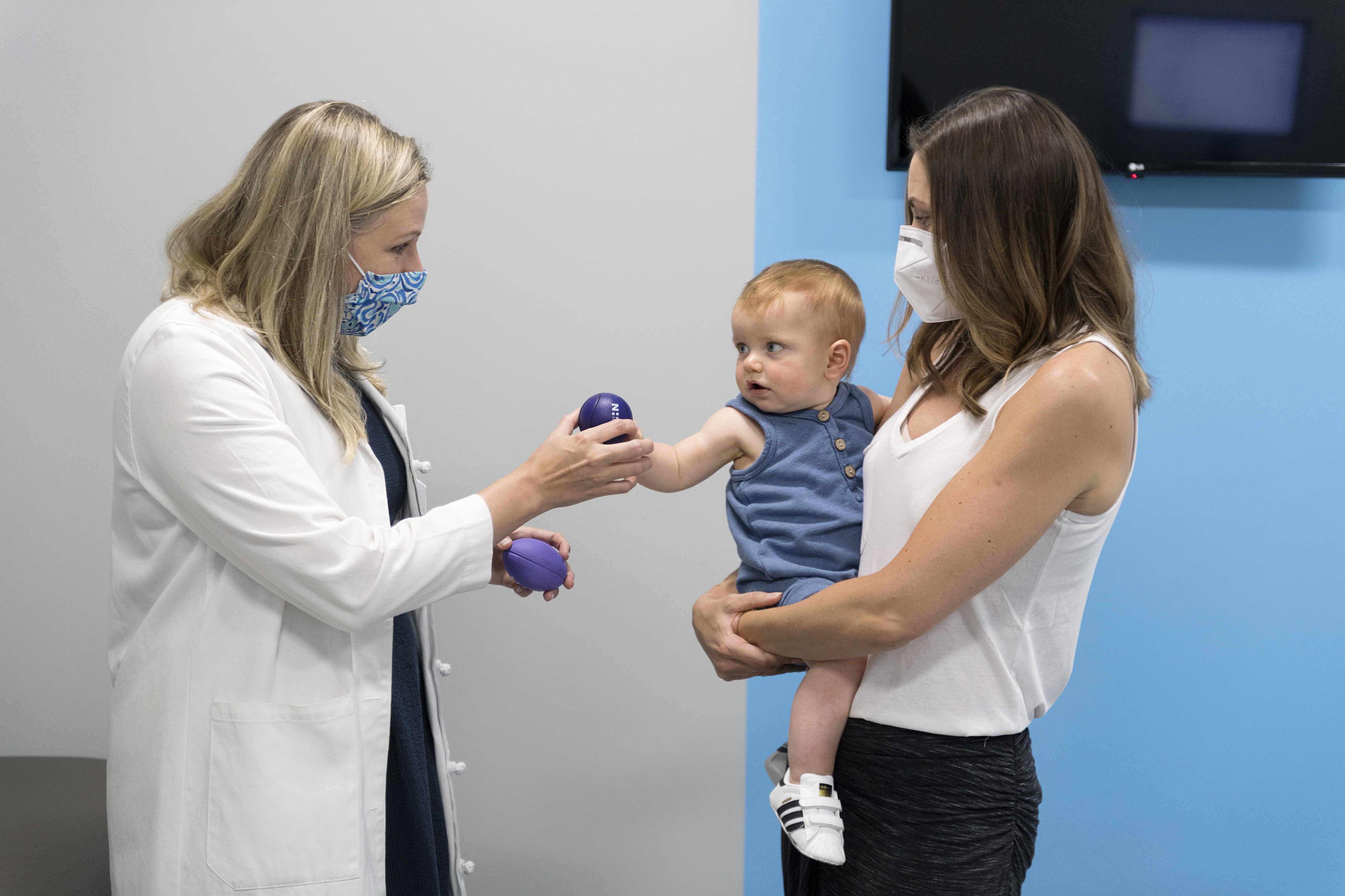 pediatrician with mom and baby