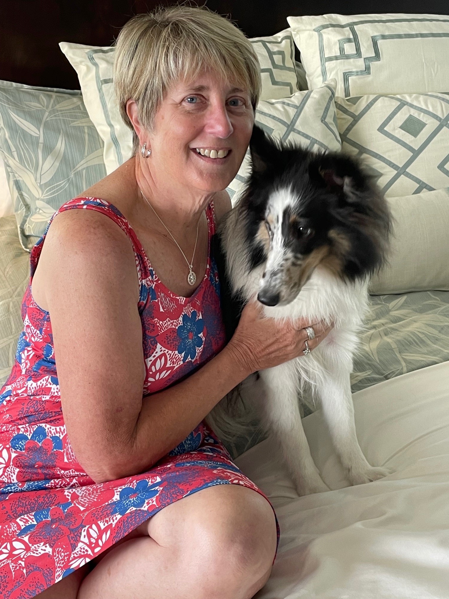 Margie "Kay" Pope, 64, smiles with her 1-year-old Sheltie puppy.