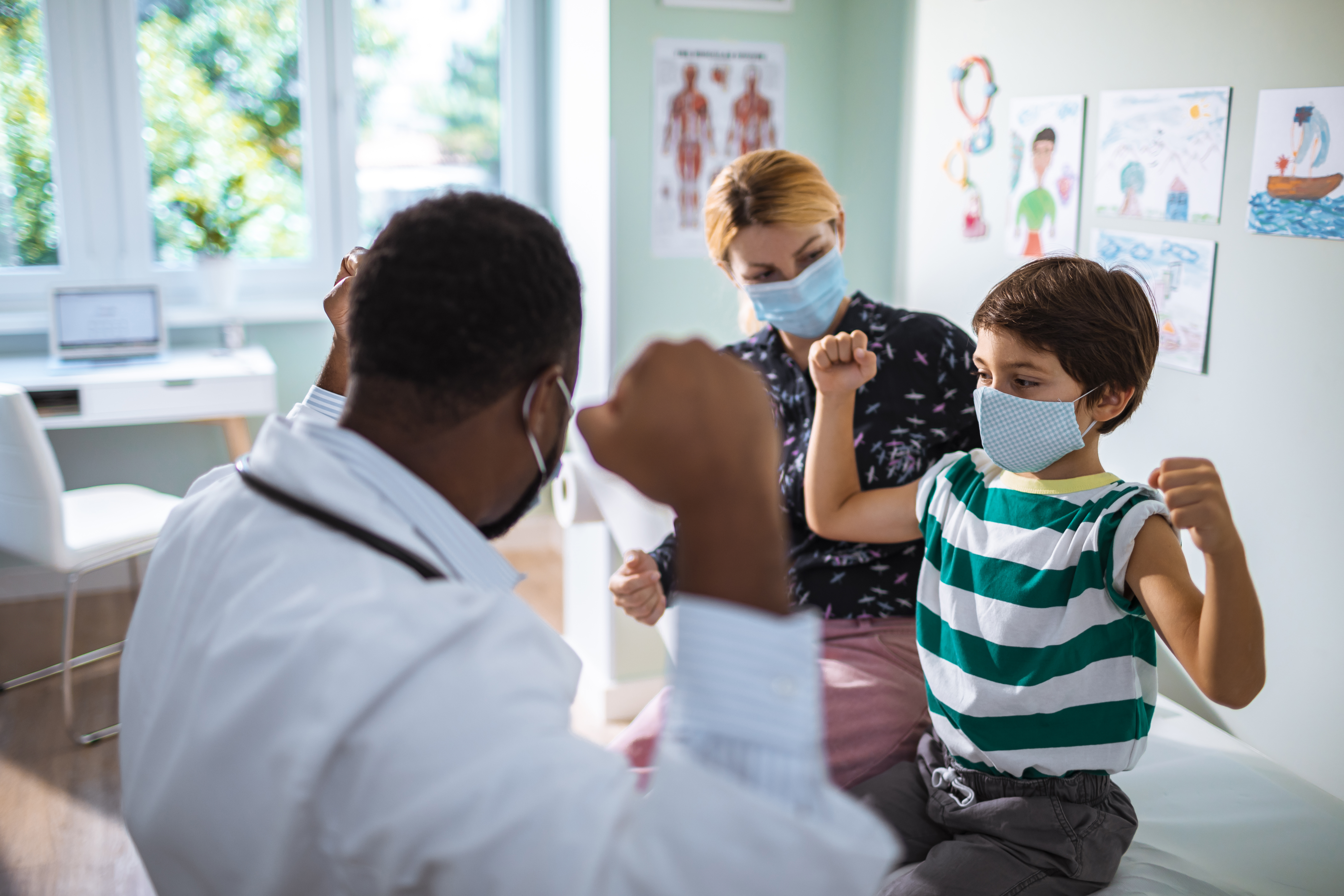 child and parent in the pediatrician's office