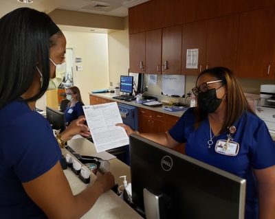 Nakisha Isom talks with team mate Whitney Crawford