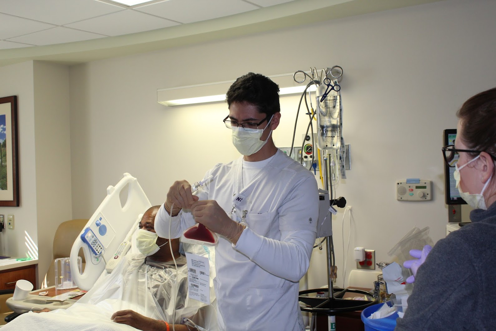 A Novant Health team member holds a bag of Covington's stem cells.