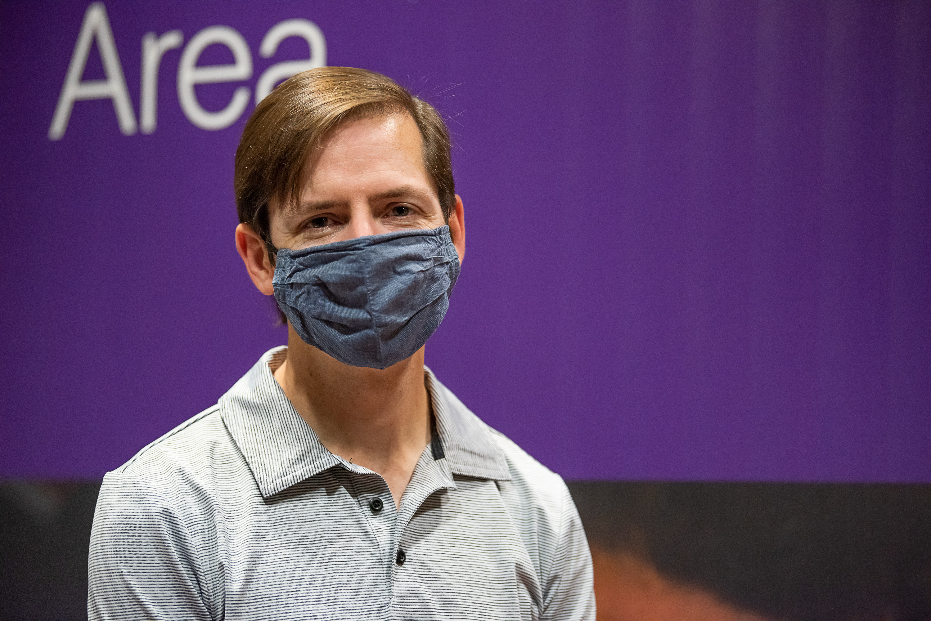 John Hippensteel smiles for a photo after getting his first COVID vaccine dose. 