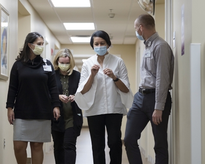 Dr. Pam Oliver is pictured with a group of colleagues.