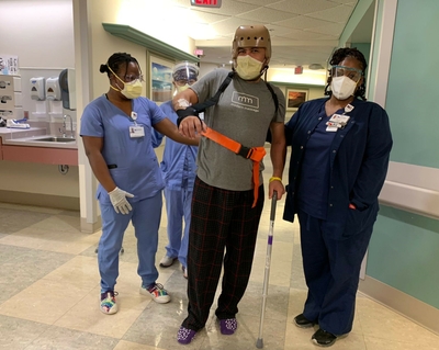 Oscar with PTs Vanessa Lane and Xin Lian and case manager Lynn McMillian