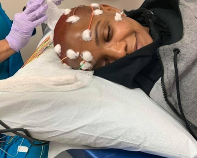 Roslyn Singleton is receiving TTF treatment to slow the growth of her cancer. She wears the portable device, called Optune, which disrupts electrical activity within cancer cells.