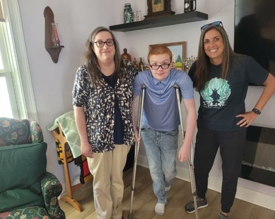 Pamela with her son Levi and sister Kim. Levi is on crutches due to a temporary injury.