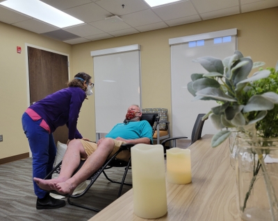 George Stilphen receives acupuncture from Sarah Girard