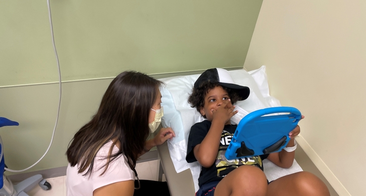 Noah Rosario and Dr. Jessica Bell exam room