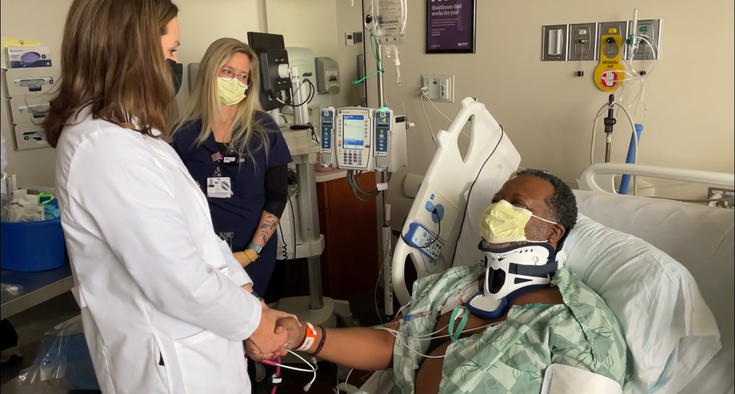 Dr. Patricia Kropf has a special moment with her patient, Tim Cooper.
