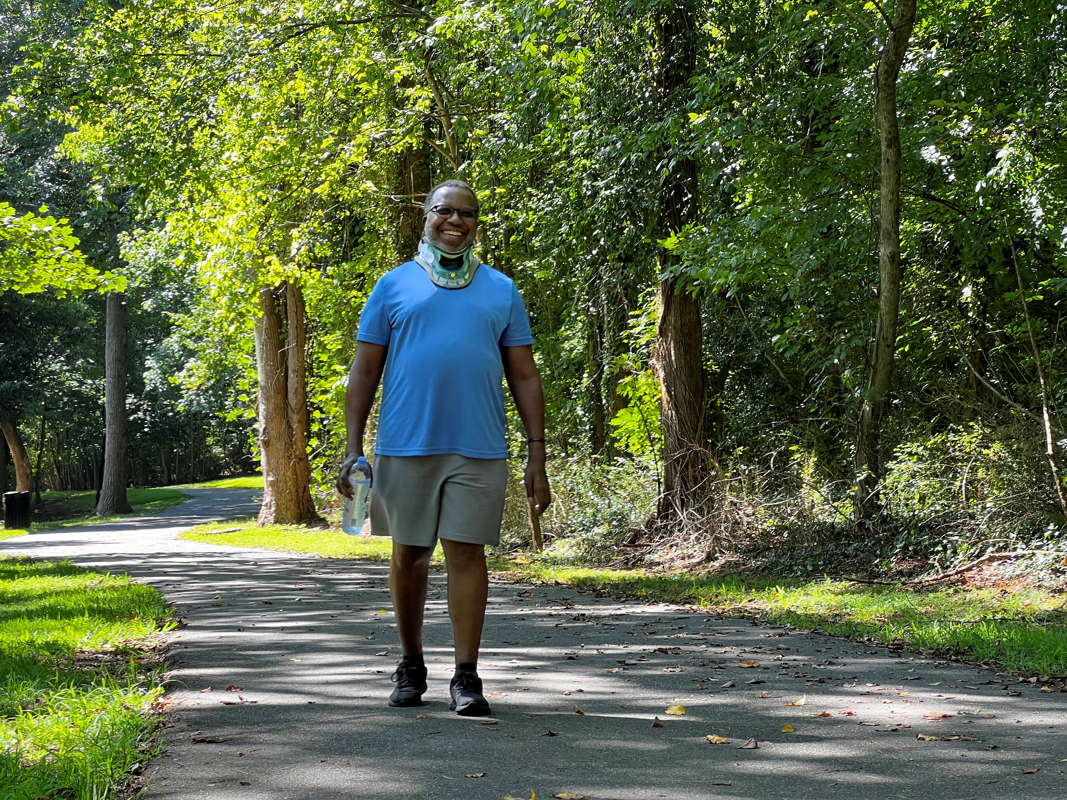Tim Cooper walks and laughs at Lineberger Park in Gastonia, North Carolina.