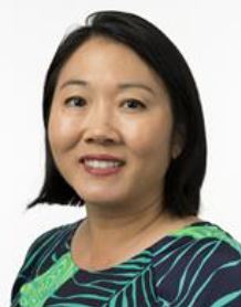 Dr. Janie Chai, an Asian female physician, smiles for a photo.