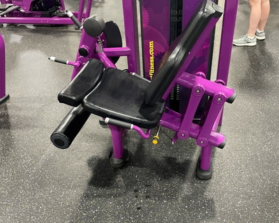 Purple knee extension machine at the gym