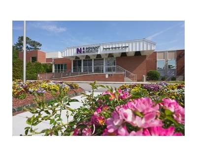 Pender Medical Center with pink azaleas blooming in the foreground.