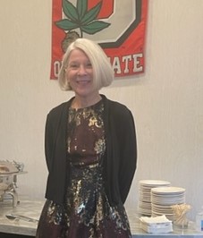 Terry Wagner stands and smiles at the camera.