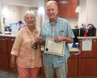 Johnny and Anita Watkins ringing the bell