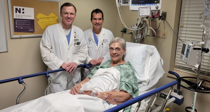 Drs Sam Turner and Robert Preli stand beside Kay Hiatt before her procedure on 12.11.2024