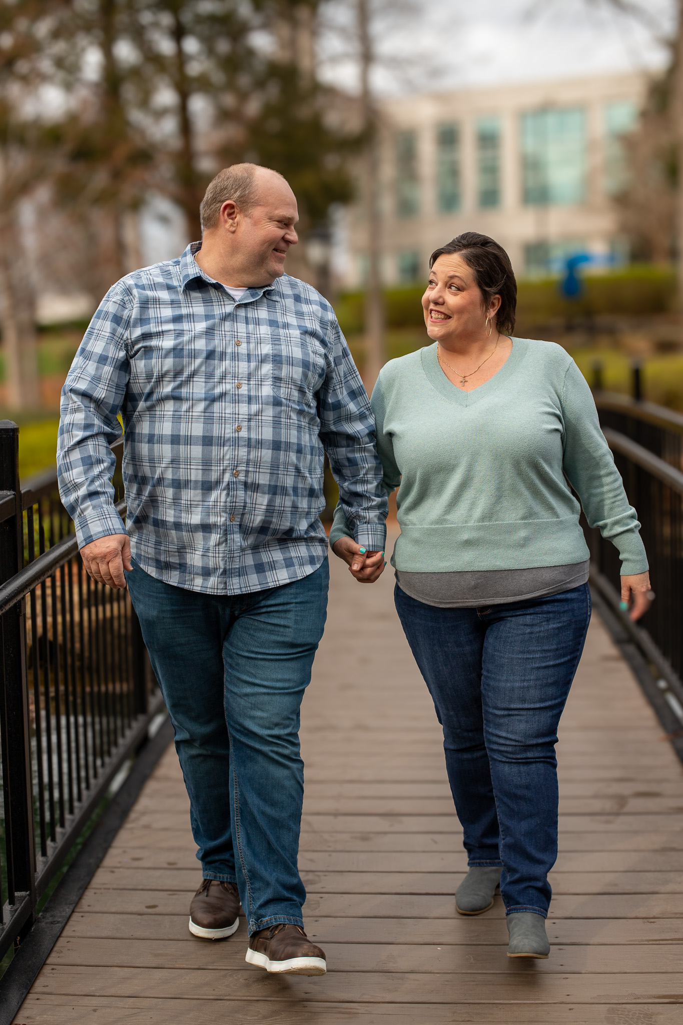 Brandon and Ellyn Fulton walk while holding hands. 